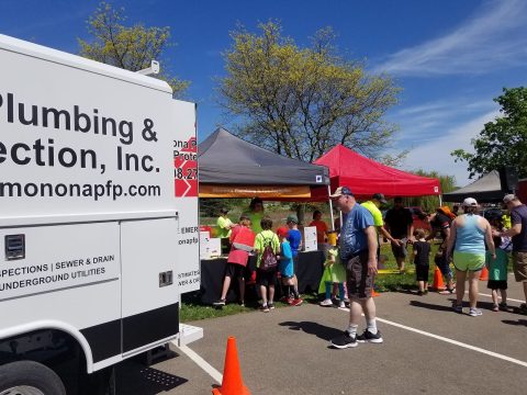 Plumbing and fire protection services at community event.