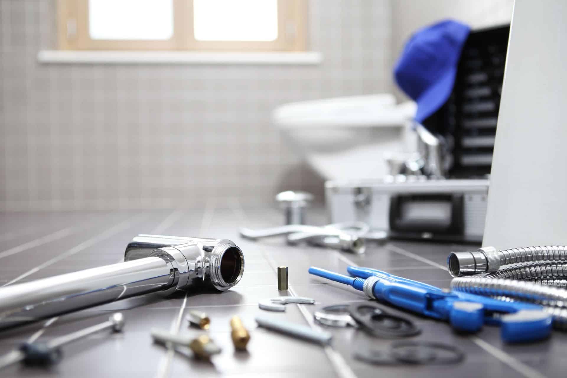 Plumbing and fire protection tools on a workbench in a professional setting.