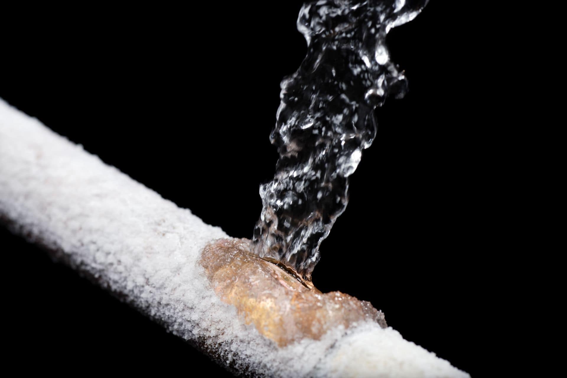 Close-up of water flowing through a pipe for plumbing and fire protection systems.