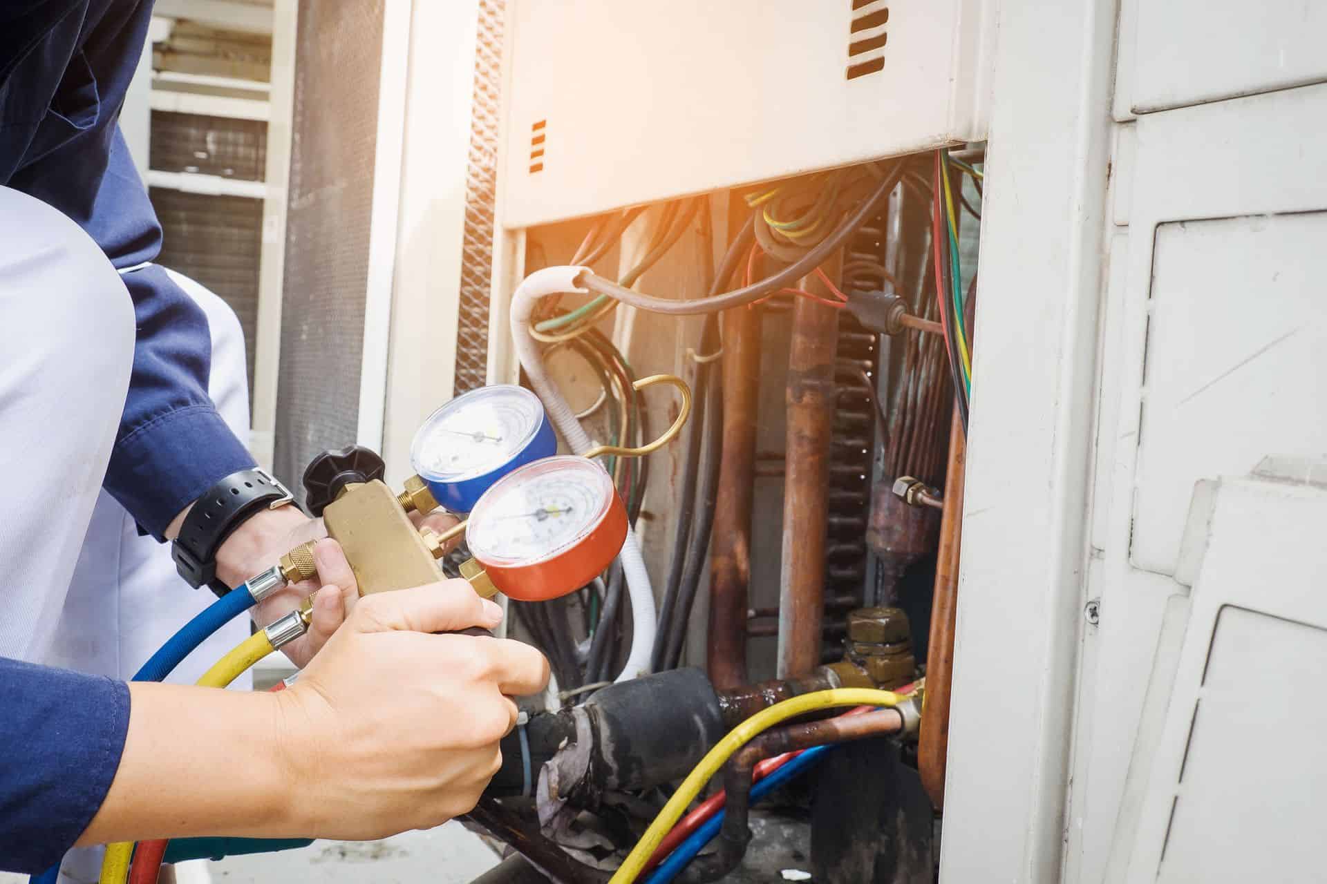 Plumber inspecting fire protection and plumbing system in electrical panel.