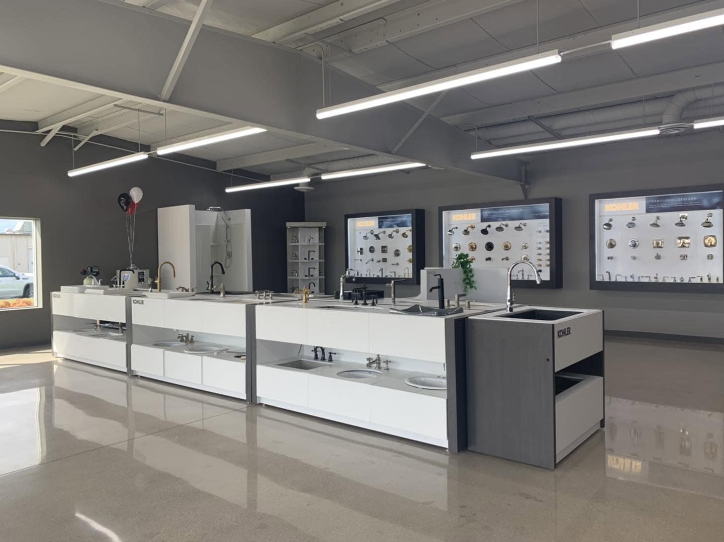 Plumbing fixtures and fire protection systems in Monona showroom.