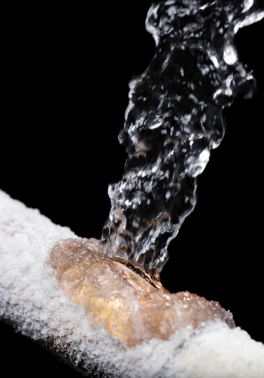 Close-up of water flowing through a pipe for plumbing and fire protection systems.