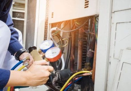 Plumber inspecting fire protection and plumbing system in electrical panel.