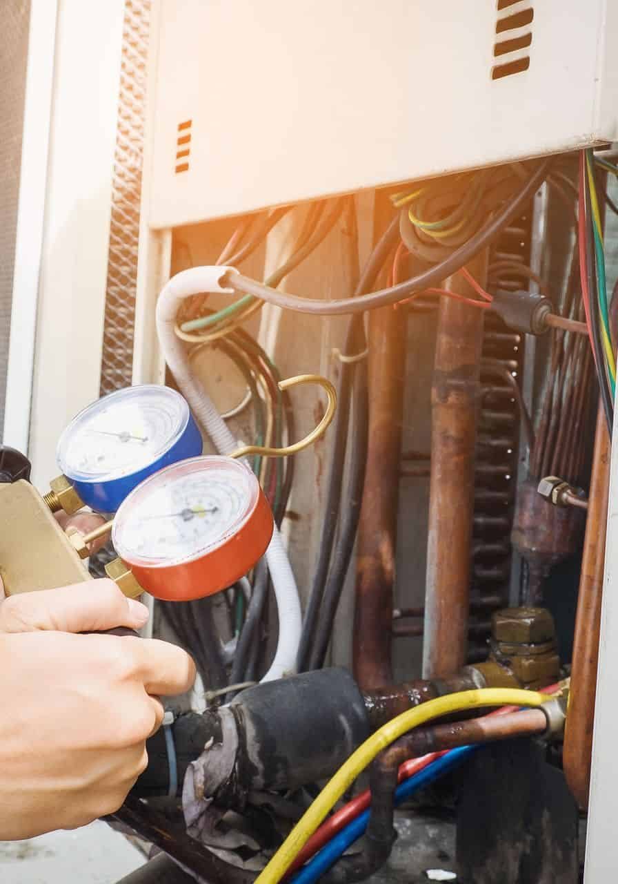 Plumber inspecting fire protection and plumbing system in electrical panel.