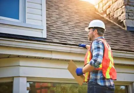 Plumber inspecting roof for fire protection and plumbing systems.