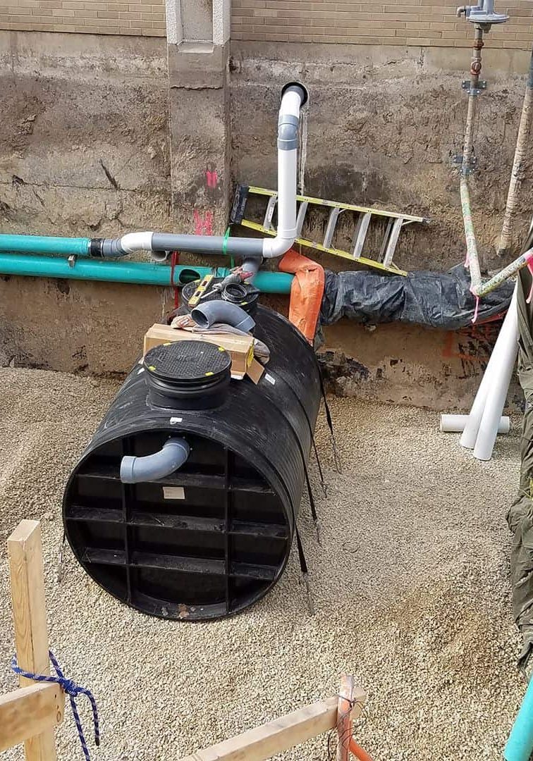 Plumbing and fire protection piping installation at construction site.