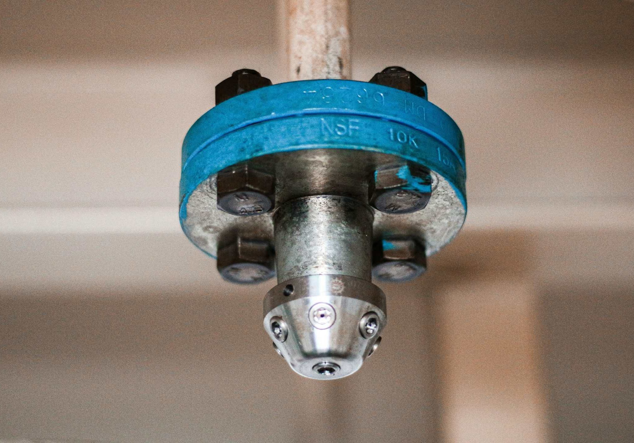 Fire sprinkler head installation for fire safety system.