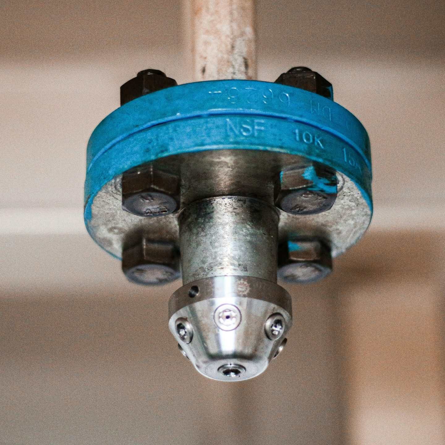 Fire sprinkler head installation for fire safety system.